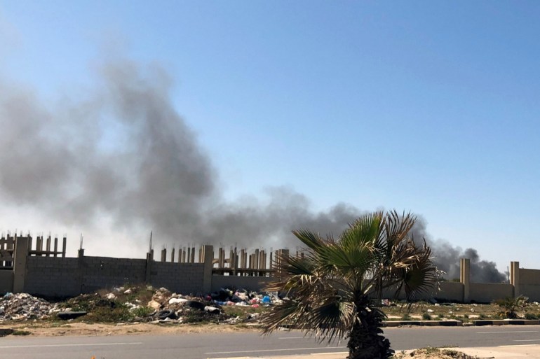 Smoke rises from Mitiga Airport after being attacked in Tripoli, Libya February 28, 2020. REUTERS/Ahmed Elumami