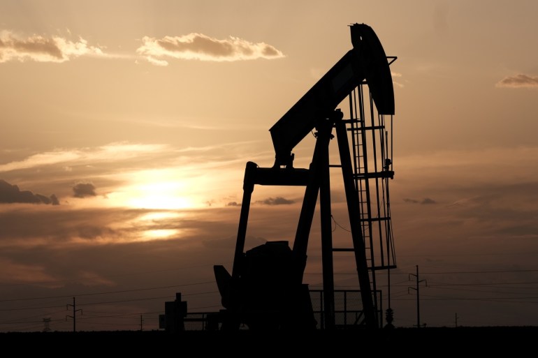 Oil pump jacks work at sunset near Midland, Texas, U.S., August 21, 2019. Picture taken August 21, 2019. REUTERS/Jessica Lutz