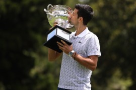 MELBOURNE, AUSTRALIA - FEBRUARY 03: Novak Djokovic of Serbia kisses the trophy as he poses during the 2020 Australian Open Men's Trophy Media Opportunity at Royal Botanic Gardens Victoria on February 03, 2020 in Melbourne, Australia. (Photo by Clive Brunskill/Getty Images)