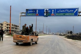 Syrian army soldiers gesture on the highway outside Maarat al-Numan, Syria, January 30, 2020. REUTERS/Omar Sanadiki
