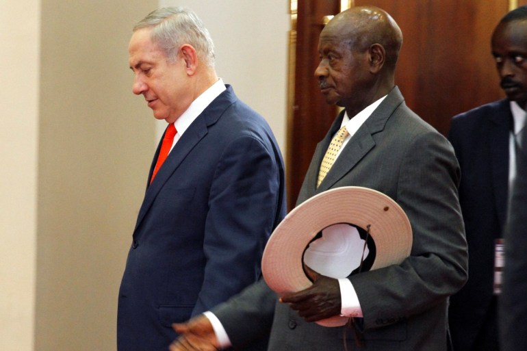 Israeli Prime Minister Benjamin Netanyahu and Ugandan President Yoweri Museveni arrive for a news conference at the State House in Entebbe, Uganda February 3, 2020. REUTERS/Abubaker Lubowa NO RESALES. NO ARCHIVES