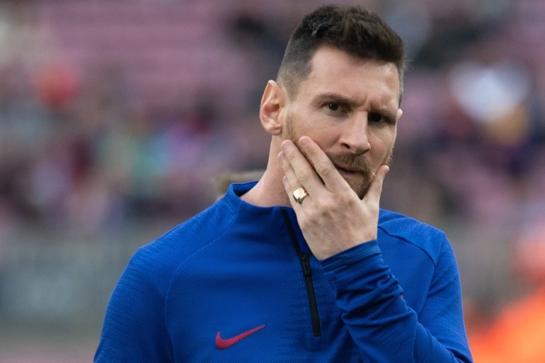 FC Barcelona and Alaves: La Liga- - BARCELONA, SPAIN - DECEMBER 21: Barcelona's Argentinian forward Lionel Messi gestures at warm up during the Spanish League football match FC Barcelona vs Alaves at the Camp Nou stadium in Barcelona on December 21, 2019.