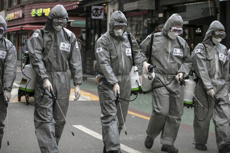 SEOUL, SOUTH KOREA - MARCH 04: South Korean soldiers, in protective gear, disinfect the Eunpyeong district against the coronavirus (COVID-19) on March 04, 2020 in Seoul, South Korea. The South Korean government has raised the coronavirus alert to the