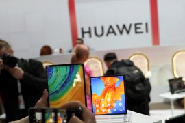 People take pictures of Huawei Mate Xs foldable smartphone and a Huawei MatePad Pro during Huawei product launch event in Barcelona, Spain February 24, 2020. REUTERS/Nacho Doce