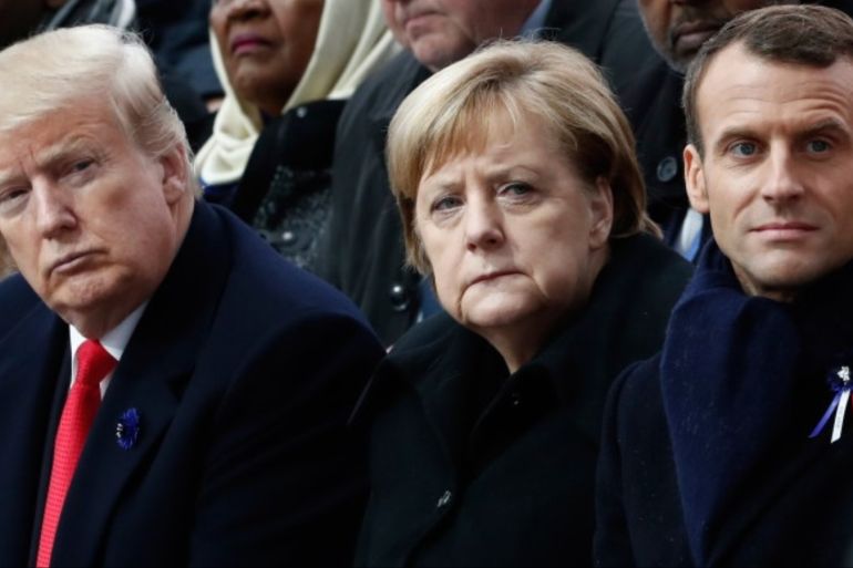 US president Donald Trump&lt; German Chancellor and French President Emmanuelle Macron