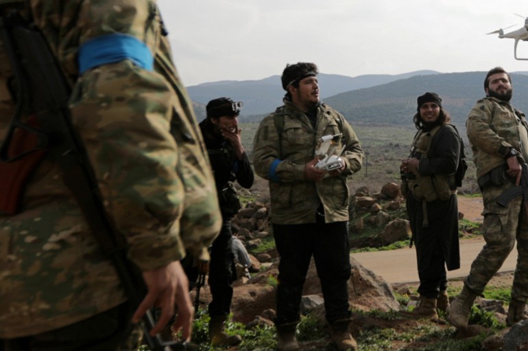 Turkish-backed fighters fly a drone in the northern Afrin countryside in Syria [File: Khalil Ashawi/Reuters]