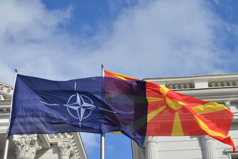 Ceremony of raising the NATO flag in Macedonia- - SKOPJE, MACEDONIA - FEBRUARY 12: Flags of Macedonia and NATO wave in front of government building in Skopje, Macedonia on February 12, 2019.