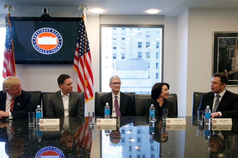 U.S. President-elect Donald Trump sits with PayPal co-founder and Facebook board member Peter Thiel, Apple Inc CEO Tim Cook, Oracle CEO Safra Catz and Tesla Chief Executive Elon Musk during a meeting with technology leaders at Trump Tower in New York U.S., December 14, 2016. REUTERS/Shannon Stapleton