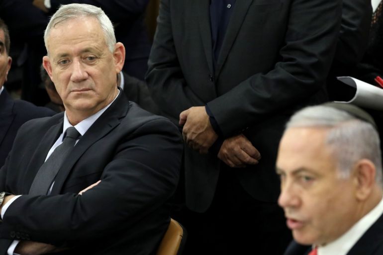 epa07972157 Leader of the blue and white political party and candidate for prime minister Benny Gantz (L) and Israeli prime minister Benjamin Netanyahu (R) attend a memorial service for Israel spiritual leader rabbi Ovadia Yosef at the Israeli Knesset (parliament) in Jerusalem, Israel, 04 November 2019. Reports state coalition talks between the Likud Party and the Blue and White Party continue without solution to the political crisis. EPA-EFE/ABIR SULTAN