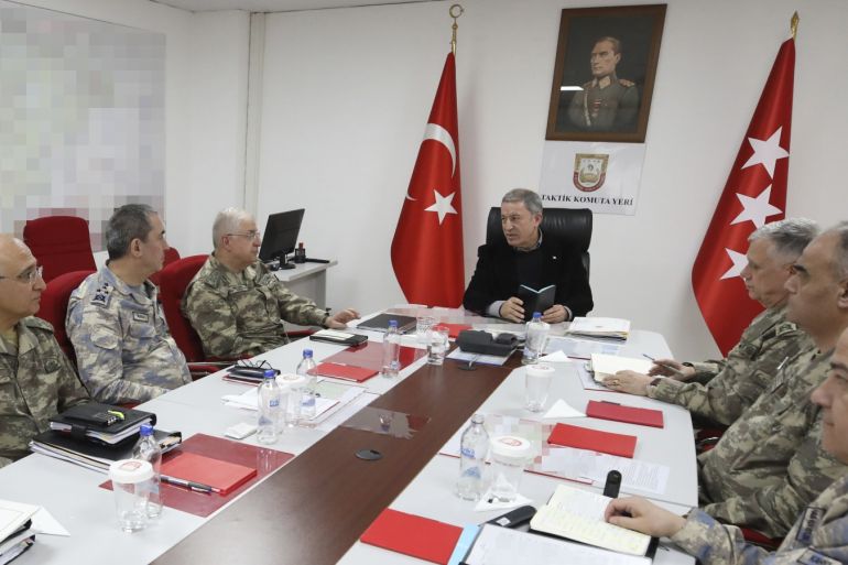 Turkish National Defense Minister Hulusi Akar- - HATAY, TURKEY - MARCH 6: Turkish National Defense Minister Hulusi Akar (C) speaks about the process in Idlib during a meeting with Chief of General Staff Gen. Yasar Guler (3rd L), Land Forces Commander Gen. Umit Dundar (3rd R) and Air Forces Commander Gen. Hasan Kucukakyuz (2nd L), at the tactical command center in the southern Hatay province, bordering Syria as he inspects the units on March 6, 2020 in Hatay, Turkey.