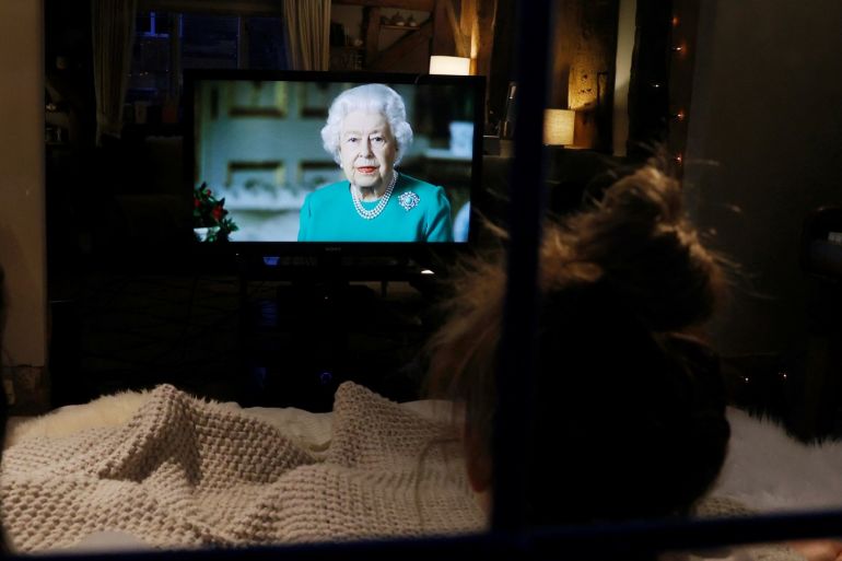 Molly, Emily and Sophie watch Britain's Queen Elizabeth II during a televised address to the nation at their home, as the spread of the coronavirus disease (COVID-19) continues, Henton, Britain, April 5, 2020. REUTERS/Eddie Keogh