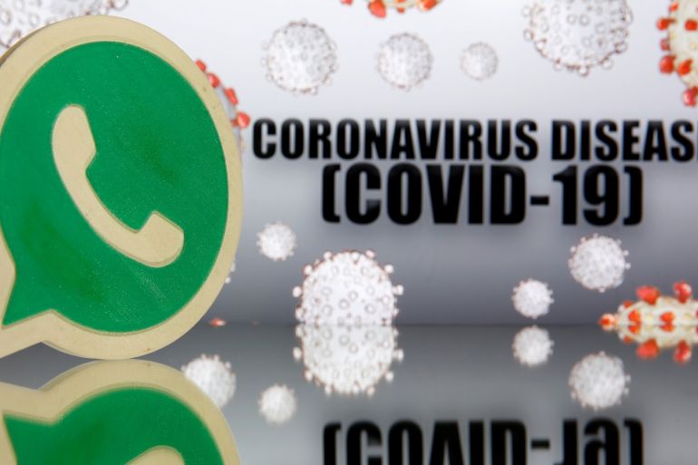 A 3D-printed Whatsapp logo is seen in front of displayed coronavirus disease (COVID-19) sign in this illustration taken March 19, 2020. REUTERS/Dado Ruvic/Illustration