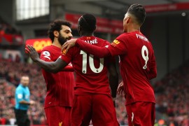 LIVERPOOL, ENGLAND - MARCH 07: Sadio Mane of Liverpool celebrates with Mohamed Salah and Roberto Firmino after scoring his team's second goal during the Premier League match between Liverpool FC and AFC Bournemouth at Anfield on March 07, 2020 in Liverpool, United Kingdom. (Photo by Jan Kruger/Getty Images)