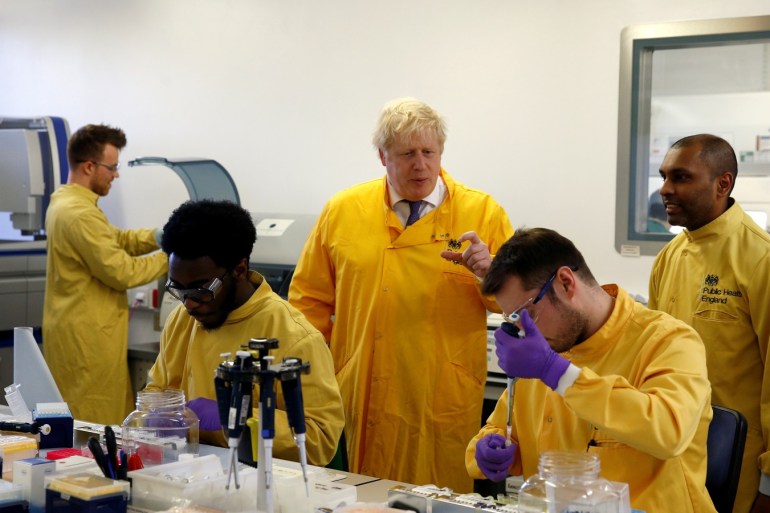 Britain's Prime Minister Boris Johnson visits a laboratory at the Public Health England National Infection Service in Colindale, north London, Britain, March 1, 2020. REUTERS/Henry Nicholls TPX IMAGES OF THE DAY