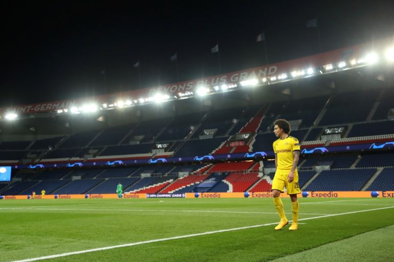 Soccer Football - Champions League - Round of 16 Second Leg - Paris St Germain v Borussia Dortmund - Parc des Princes, Paris, France - March 11, 2020 Borussia Dortmund's Axel Witsel walks around the pitch after being substituted as the match is played behind closed doors while the number of coronavirus cases grow around the world UEFA Pool/Handout via REUTERS ATTENTION EDITORS - THIS IMAGE HAS BEEN SUPPLIED BY A THIRD PARTY.