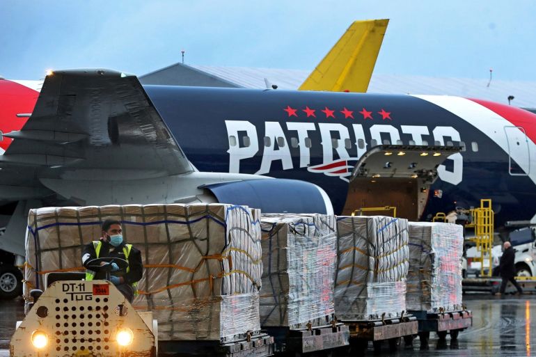 A New England Patriots Boeing 767-300 jet with a shipment of over one million N95 masks from China, which will be used in Boston and New York to help fight the spread of the coronavirus disease (COVID-19), arrives at Logan Airport, Boston, Massachusetts, U.S., April 2, 2020. Jim Davis/Pool via REUTERS
