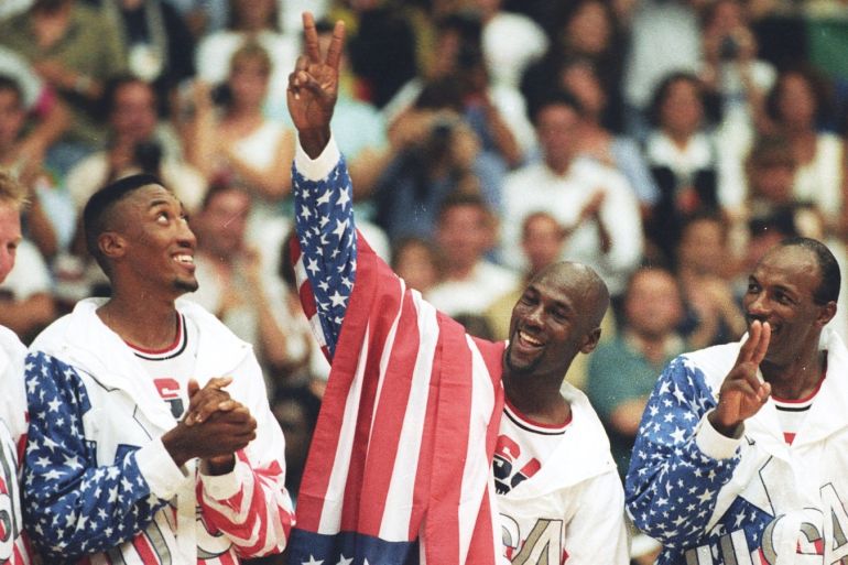 FILE PHOTO: U.S. basketball player Michael Jordan (2nd R) flashes a victory sign as he stands with team mates Larry Bird (L), Scottie Pippen and Clyde Drexler (R), nicknamed the ?Dream Team? after winning the Olympic gold in Barcelona, Spain August 8, 1992. REUTERS/Ray Stubblebine/File Photo