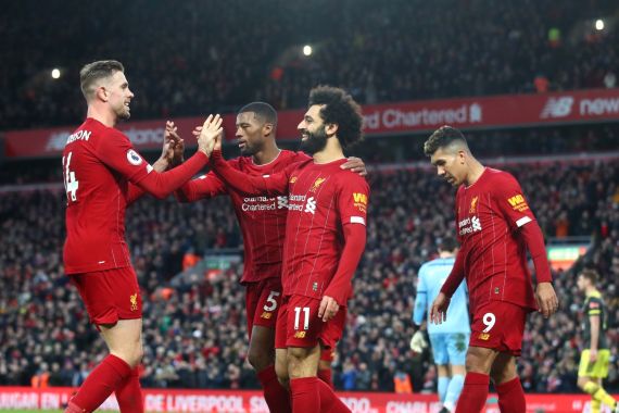 LIVERPOOL, ENGLAND - FEBRUARY 01: Mohamed Salah of Liverpool celebrates with Georginio Wijnaldum, Jordan Henderson and Roberto Firmino after scoring his team's third goal during the Premier League match between Liverpool FC and Southampton FC at Anfield on February 01, 2020 in Liverpool, United Kingdom. (Photo by Julian Finney/Getty Images)