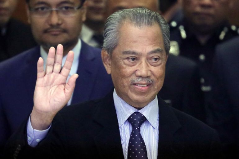 Malaysia's Prime Minister Muhyiddin Yassin waves to reporters before his cabinet announcement in Putrajaya, Malaysia March 9, 2020. REUTERS/Lim Huey Teng