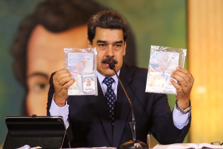 Personal documents are shown by Venezuela's President Nicolas Maduro during a virtual news conference in Caracas