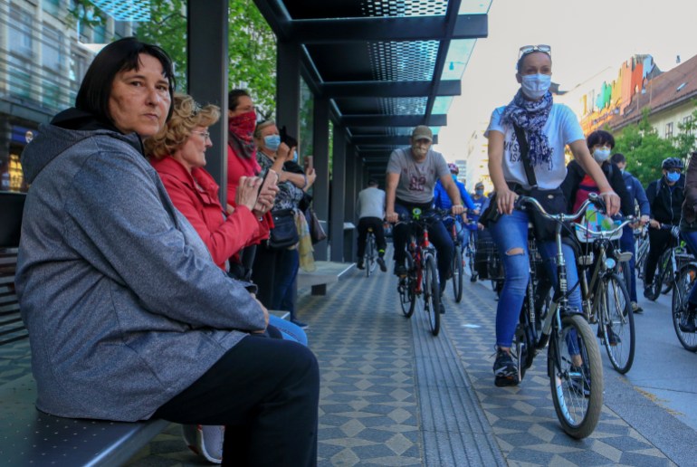 Protesters ride bicycles during an anti-government protest in Ljubljana