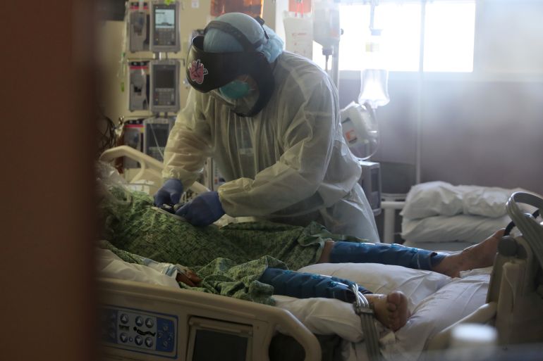 A patient suffering from the coronavirus disease (COVID-19) is treated in the Intensive Care Unit (ICU), at Scripps Mercy Hospital in Chula Vista