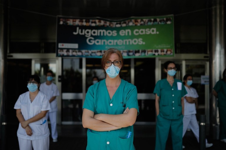 Covid-19 measures in Spain- - MADRID, SPAIN - MAY 8: Medical officials of 12 de Octubre Hospital stand in silence for those who lost their lives due to the novel coronavirus (Covid-19) pandemic, on May 8, 2020 in Madrid, Spain. In total, Spanish Health Ministry has counted nearly 223,000 confirmed COVID-19 cases and 26,299 deaths. More than 121,700 people have been hospitalized and 131,148 have recovered from the disease.