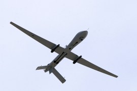 A U.S. Air Force MQ-1 Predator, unmanned aerial vehicle, armed with AGM-114 Hellfire missiles, performs a low altitude pass during the Aviation Nation 2005 air show at Nellis Air Force Base in this handout photo