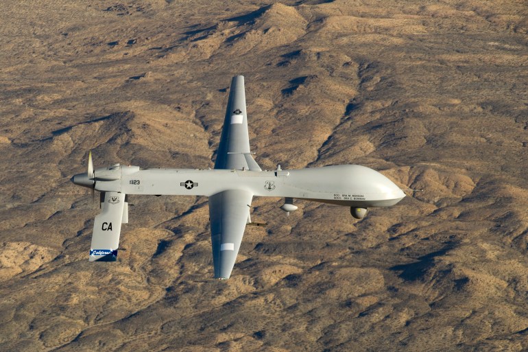 A U.S. Air Force MQ-1 Predator unmanned aerial vehicle flies near the Southern California Logistics Airport in Victorville, California in this USAF handout photo
