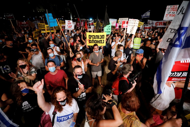 Israelis demonstrate against PM Netanyahu and his government's handling of COVID-19 crisis, in Tel Aviv