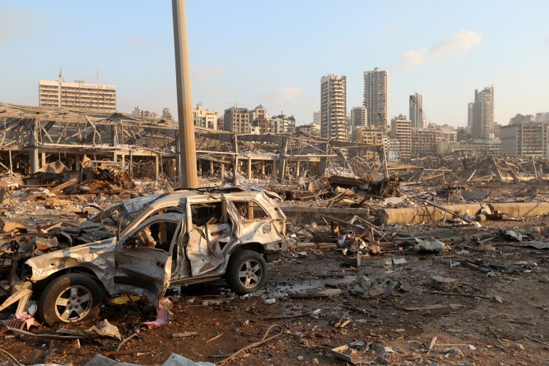 A damaged vehicle is seen at the site of an explosion in Beirut