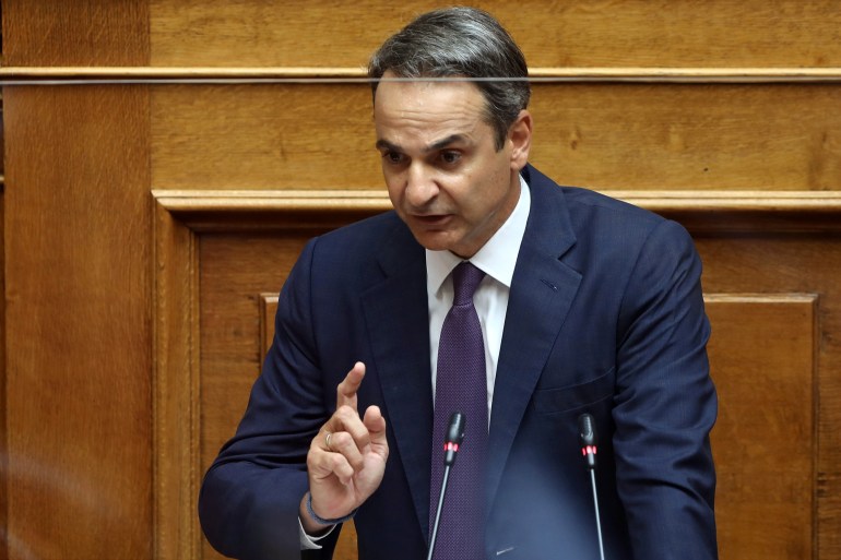 Greek Prime Minister Kyriakos Mitsotakis speaks during a parliamentary session on an accord which defines maritime boundaries with Egypt in the Mediterranean, at the parliament in Athens