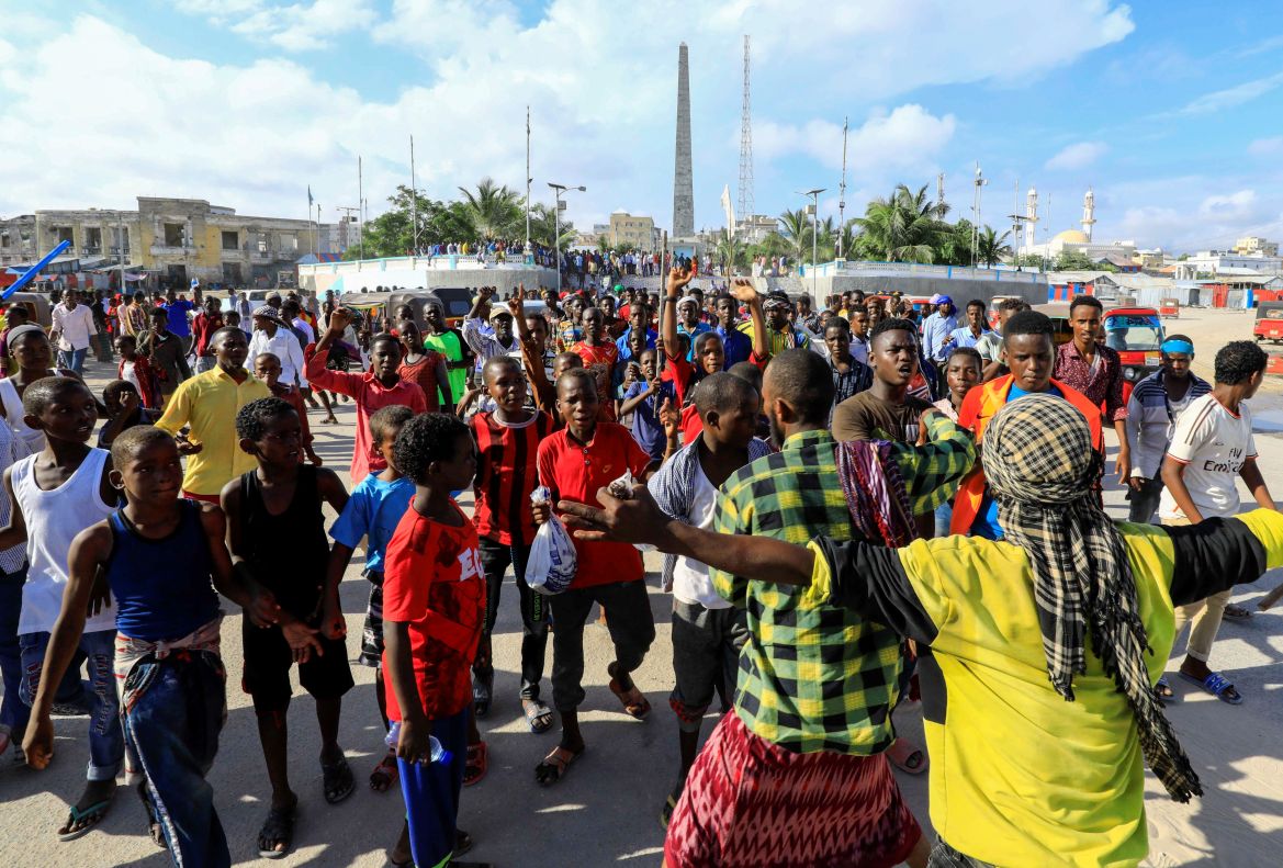 Somalis march during a protest against the publications of a cartoon of Prophet Mohammad in France and French President Emmanuel Macron's comments, along the streets of Mogadishu