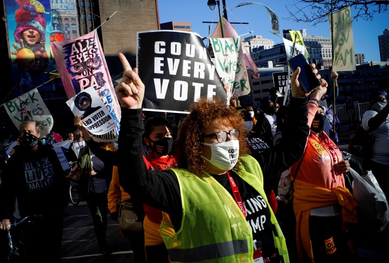 People take part in a rally demanding a fair count of the votes of the 2020 U.S. presidential election, in Philadelphia