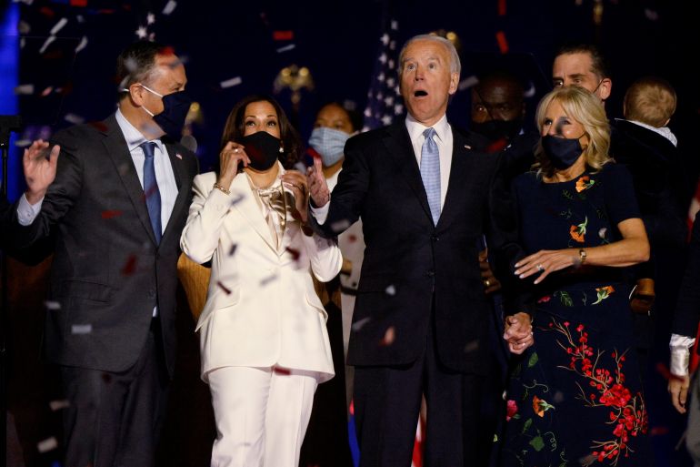 Democratic 2020 U.S. presidential nominee Biden vice presidential nominee Harris react to the confetti at their election rally in Wilmington