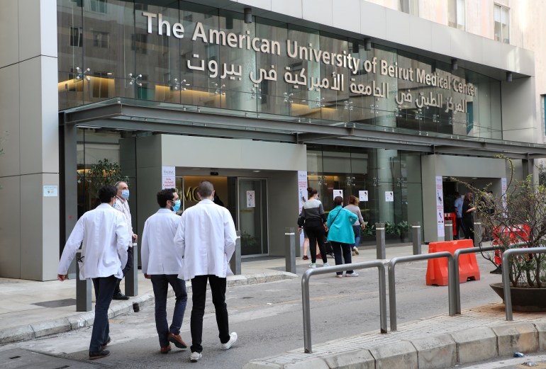 People walk outside the American University of Beirut (AUB) medical centre in Beirut