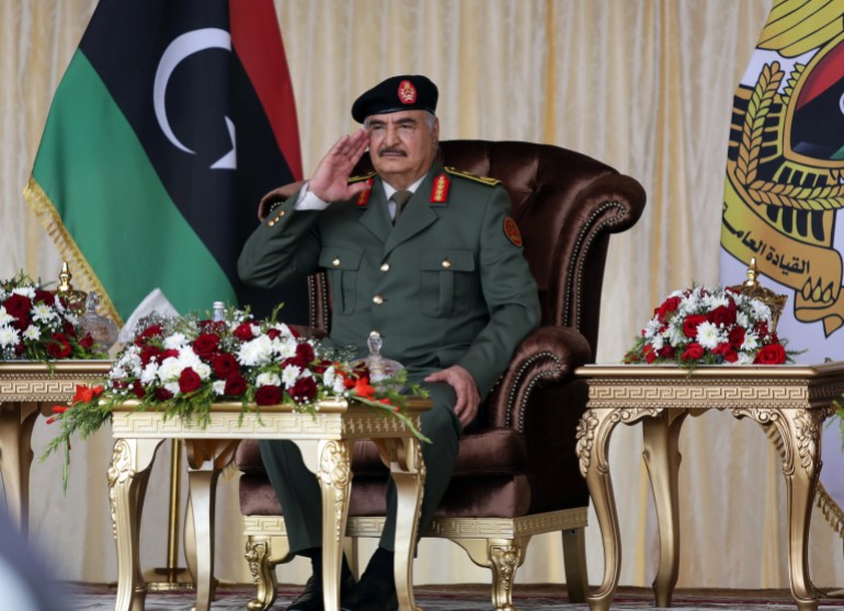 Libyan military commander Khalifa Haftar gestures during Independence Day celebrations in Benghazi