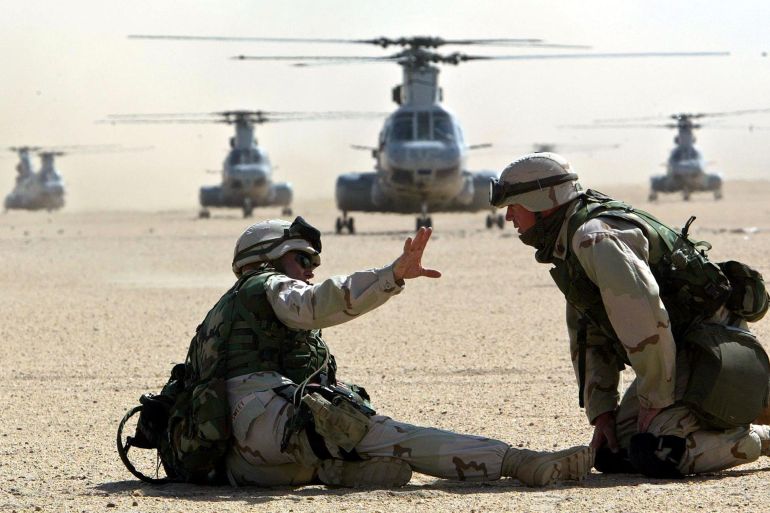 U.S. MARINES DRILL IN KUWAITI DESERT NEAR IRAQ.