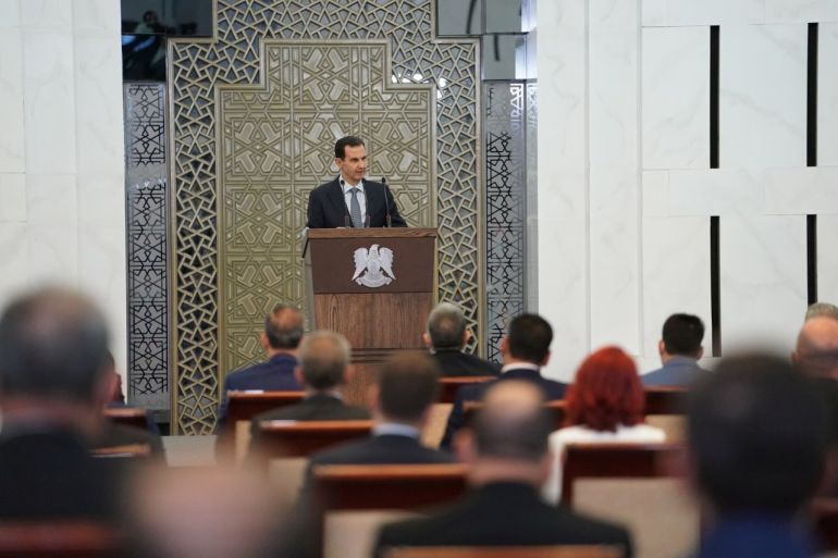 Syria's President Bashar al-Assad addresses the new members of parliament in Damascus