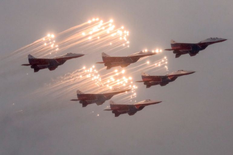 Russian aerobatic team Strizhi (The Swifts) performs on MIG-29 during the parade to mark 75 years since Leningrad siege was lifted during the World War Two, in Saint Petersburg