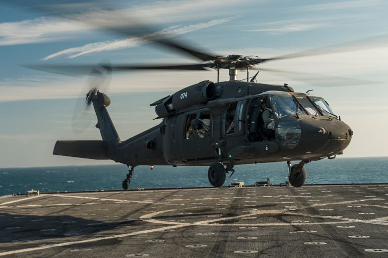 Handout photo of a U.S. Army UH-60 Blackhawk helicopter landing on a ship in the Arabian Gulf