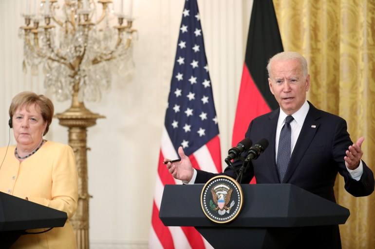 U.S. President Joe Biden and German Chancellor Angela Merkel attend a joint news conference in the East Room at the White House