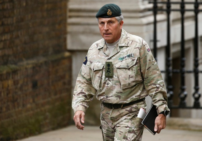 British Army General Sir Nick Carter arrives for a meeting to address the government's response to the coronavirus outbreak, at Downing Street in London