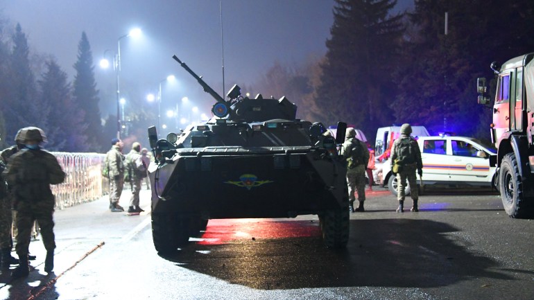 An armoured personnel carrier is seen near the mayor's office in Almaty