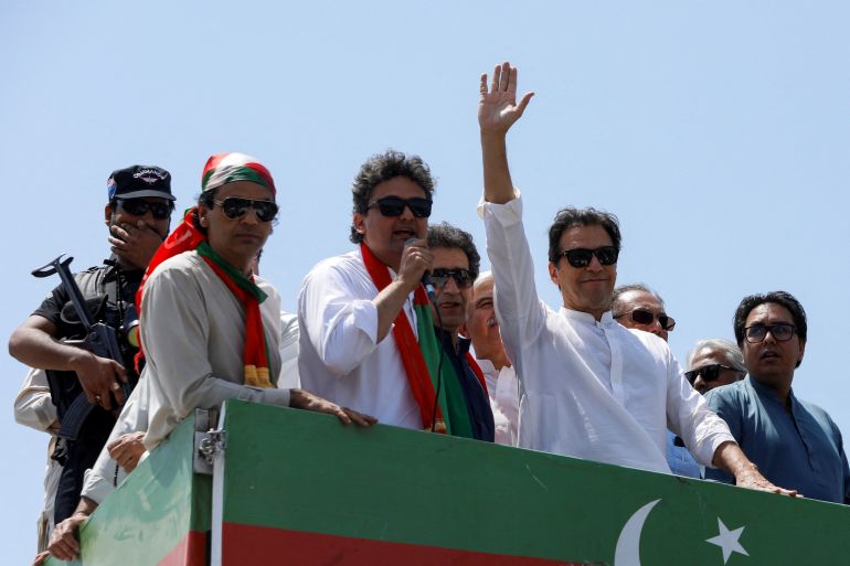 Ousted Pakistani PM Khan gestures as he travels to lead protest march to Islamabad, in Mardan