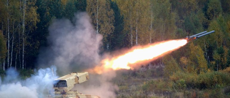 A Russian “TOS-1 Buratino” multiple rocket launcher fires during the “Russia Arms Expo 2013” 9th international exhibition of arms, military equipment and ammunition, in the Urals city of Nizhny Tagil