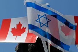2014年渥太华支持以色列的示威活动中可以看到加拿大和以色列国旗 (路透)